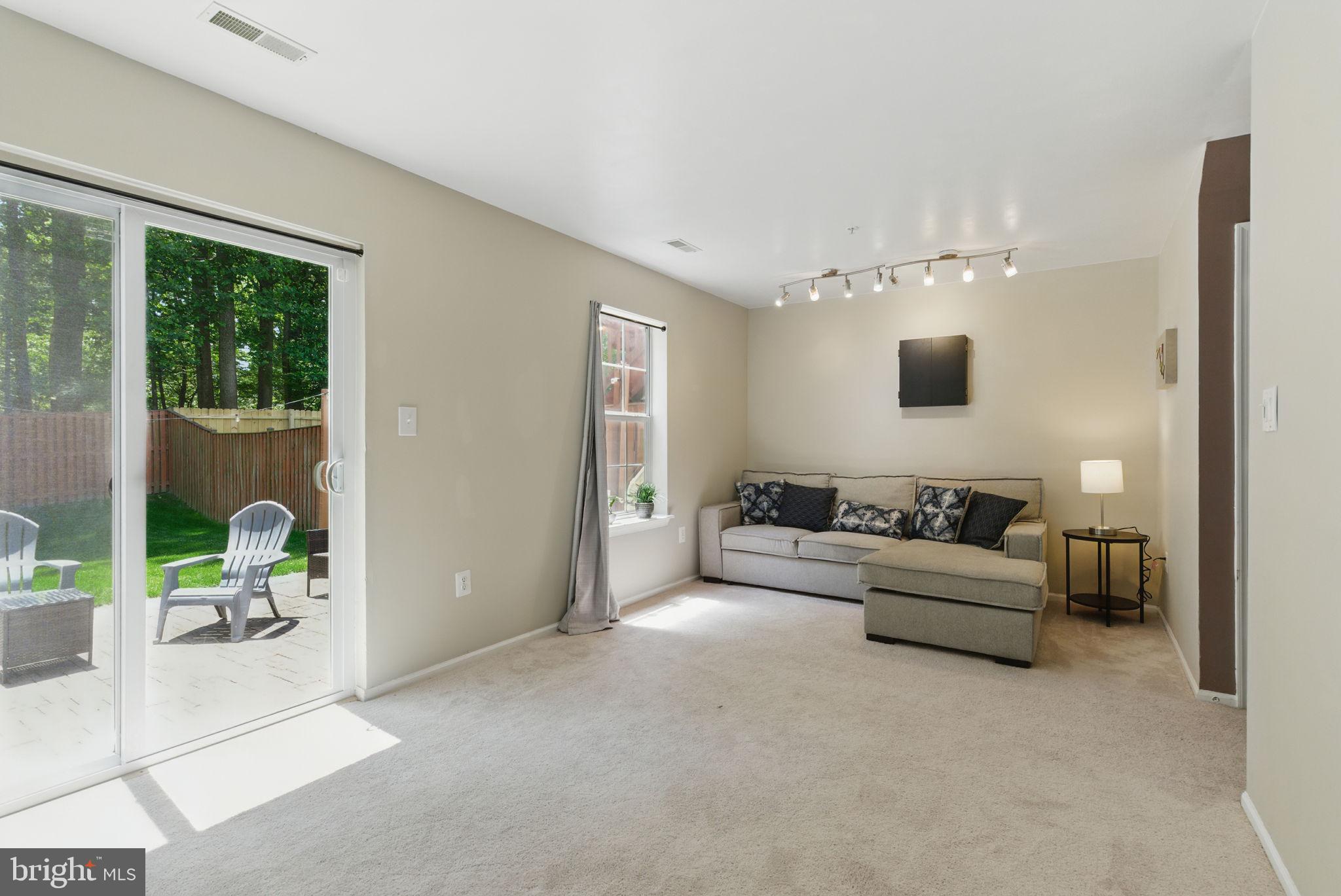 3559 Orchard Shade Road Randallstown, MD 21133 - Photo 15 of 18 a living room with furniture and a flat screen tv