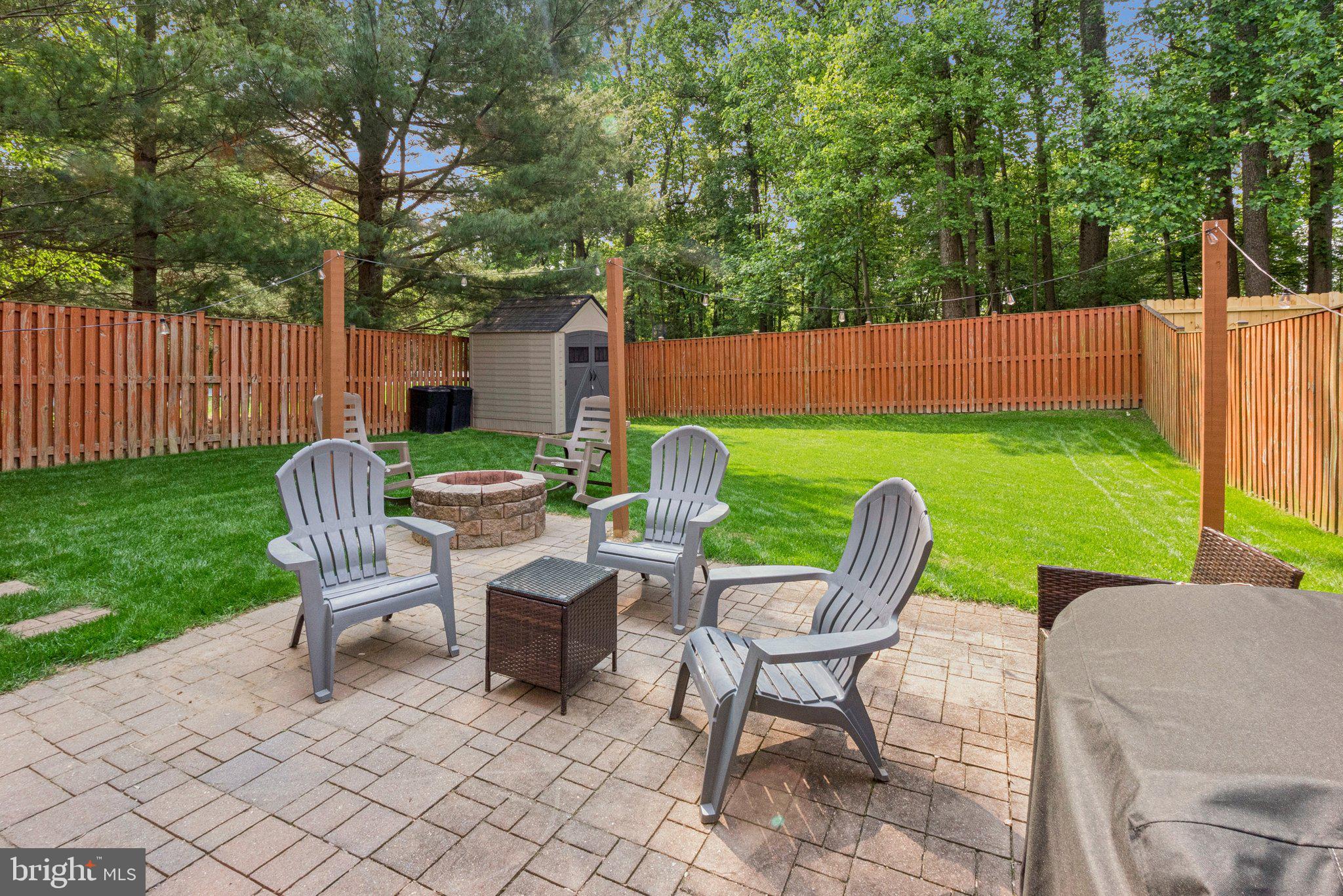 3559 Orchard Shade Road Randallstown, MD 21133 - Photo 17 of 18 a view of a house with backyard sitting area and garden