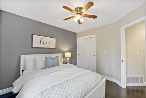 a bedroom with a large bed and a window