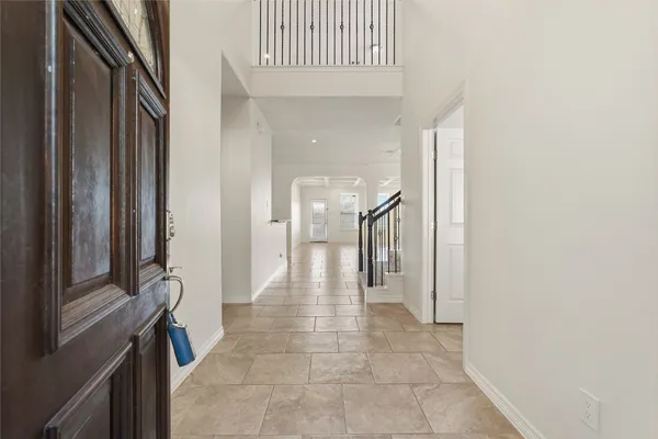 a kitchen with stainless steel appliances granite countertop stove a sink a oven a refrigerator and island