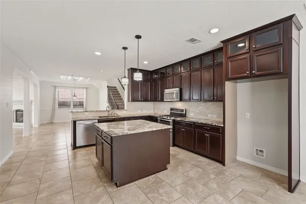 a kitchen with stainless steel appliances granite countertop granite counter tops and a sink