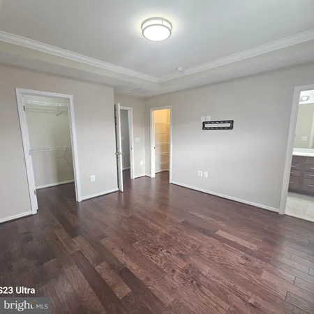 a view of a livingroom with wooden floor