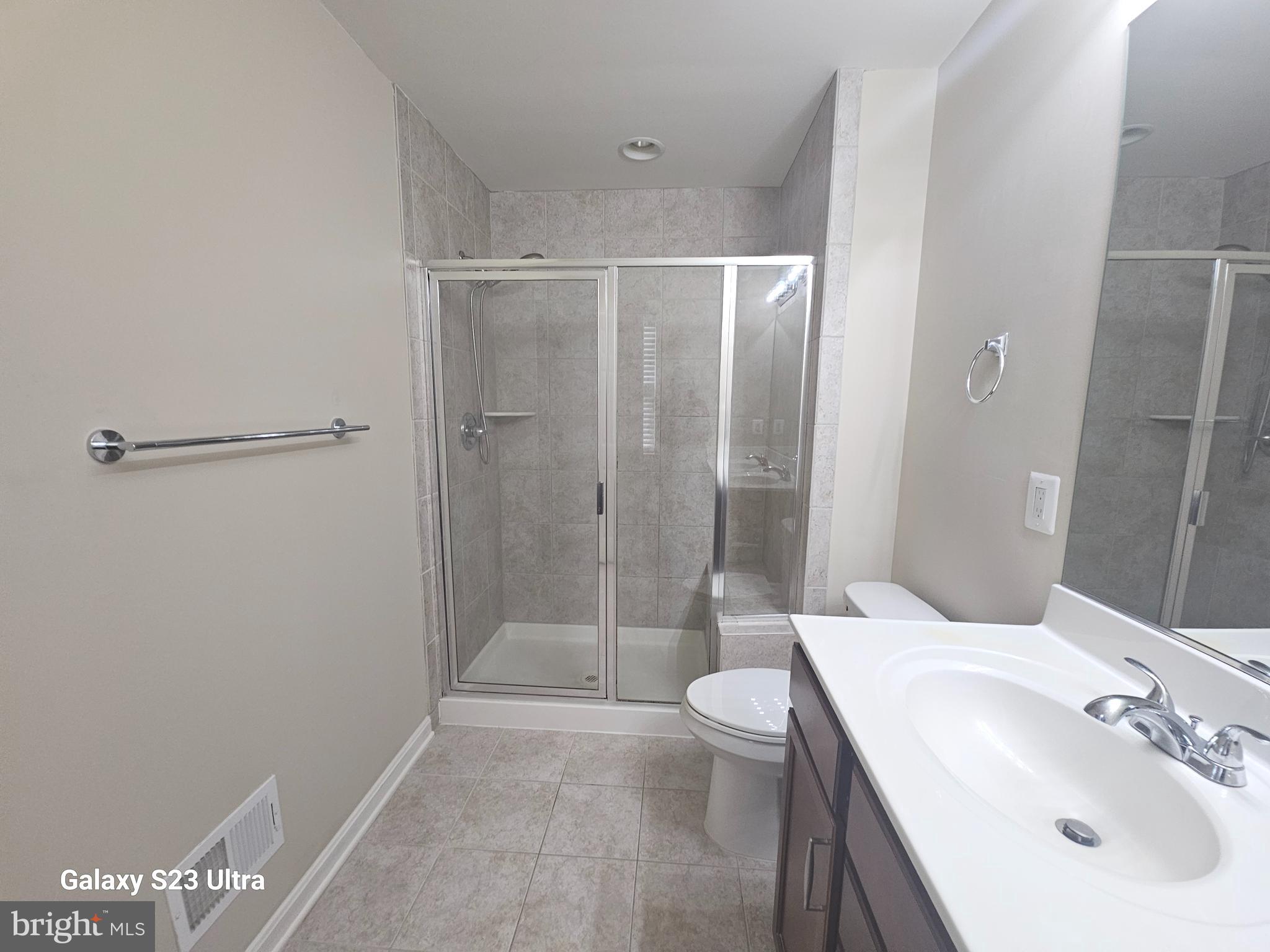 25634 Pleasant Valley Road Chantilly, VA 20152 - Photo 25 of 40 a bathroom with a sink mirror toilet and shower