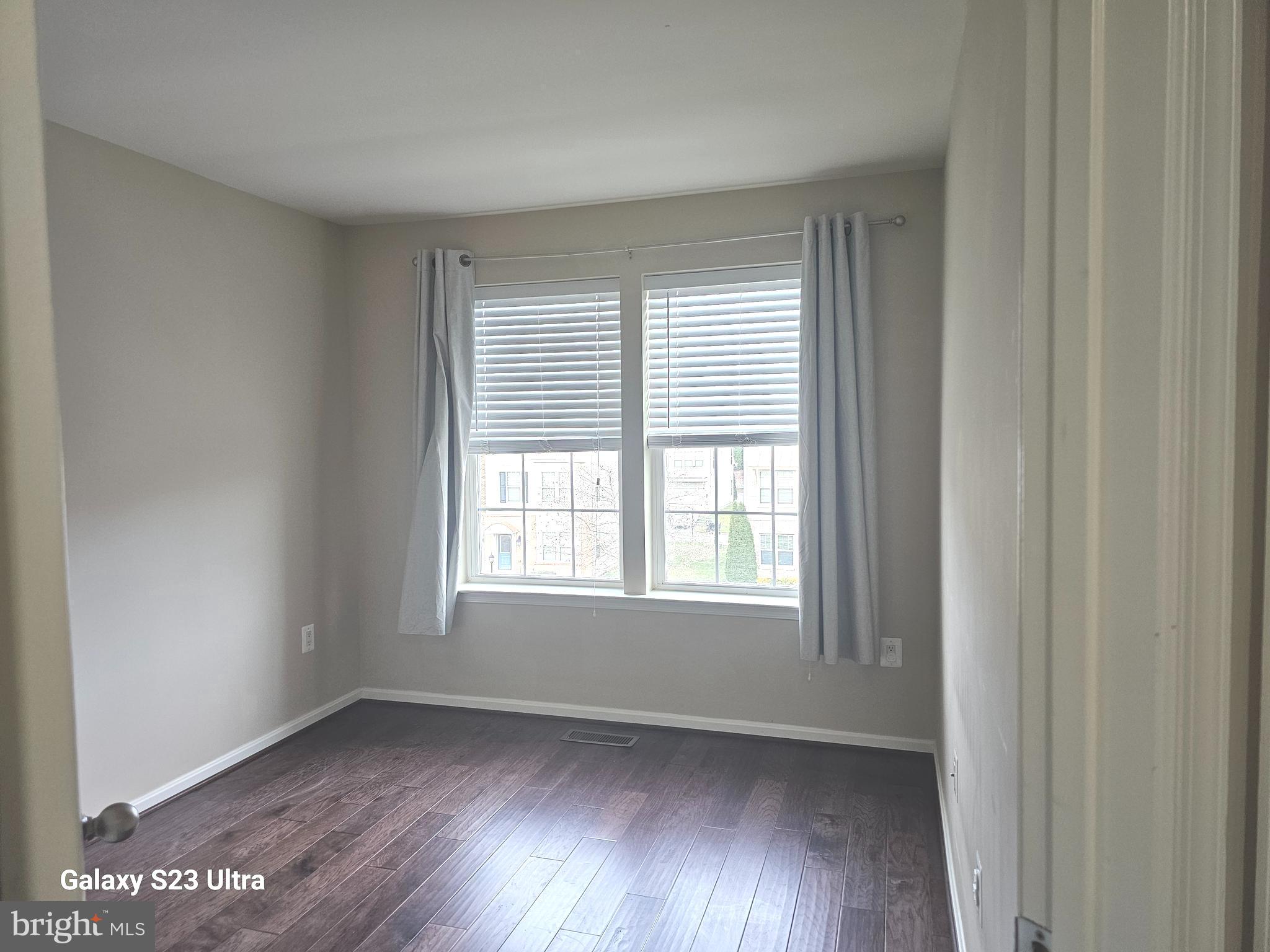 25634 Pleasant Valley Road Chantilly, VA 20152 - Photo 29 of 40 a view of an empty room with wooden floor and a window