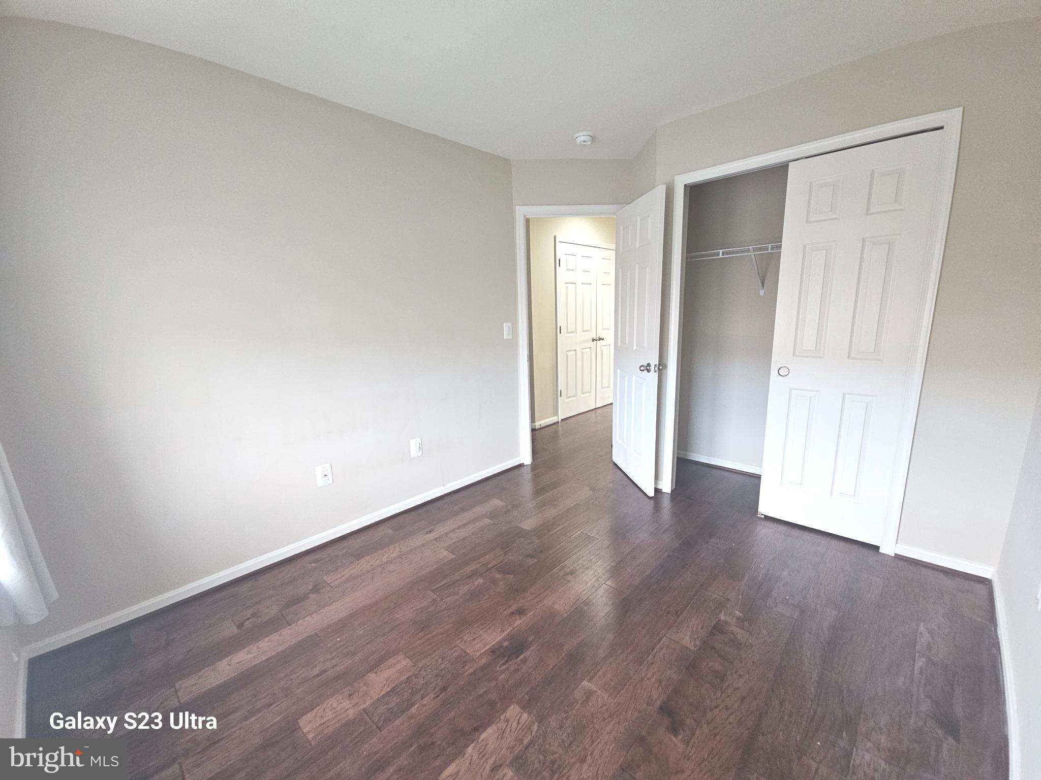 25634 Pleasant Valley Road Chantilly, VA 20152 - Photo 30 of 40 a view of an empty room with wooden floor