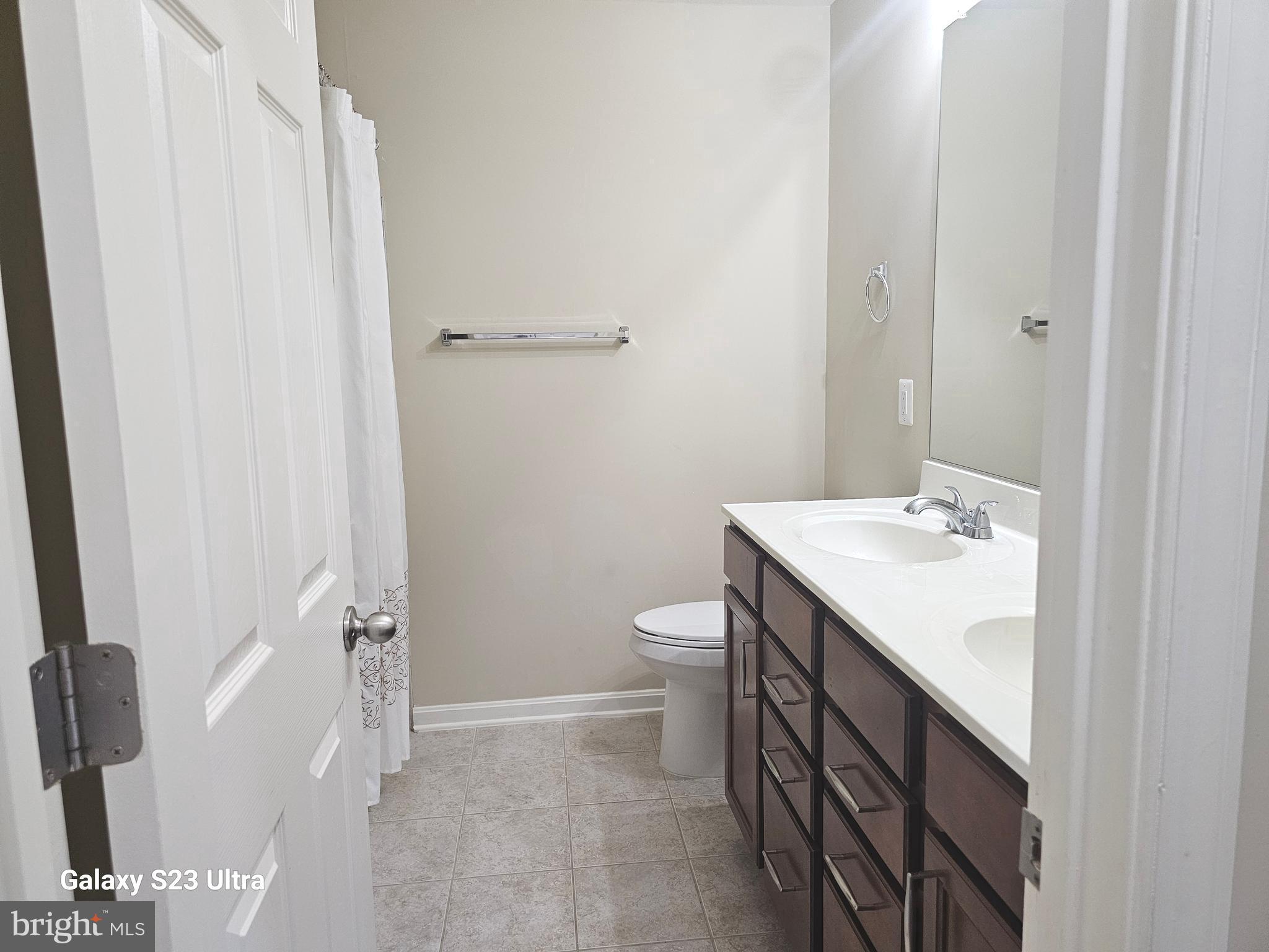 25634 Pleasant Valley Road Chantilly, VA 20152 - Photo 34 of 40 a bathroom with a sink a toilet and shower