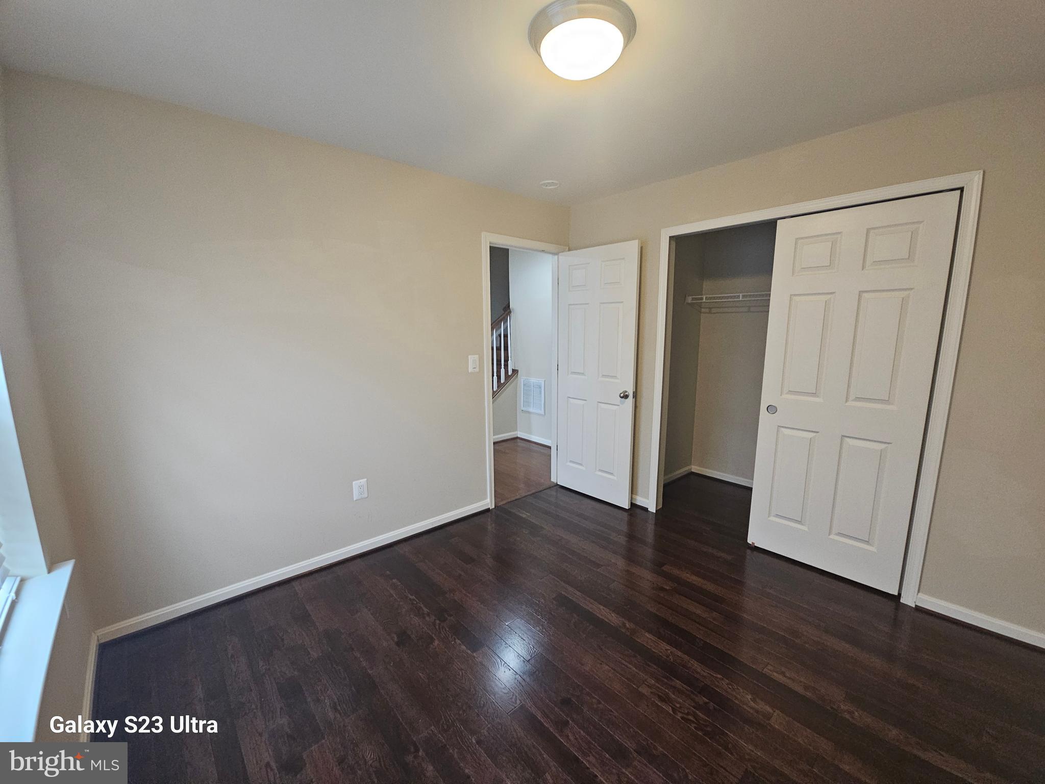 25634 Pleasant Valley Road Chantilly, VA 20152 - Photo 4 of 40 a view of an empty room with wooden floor