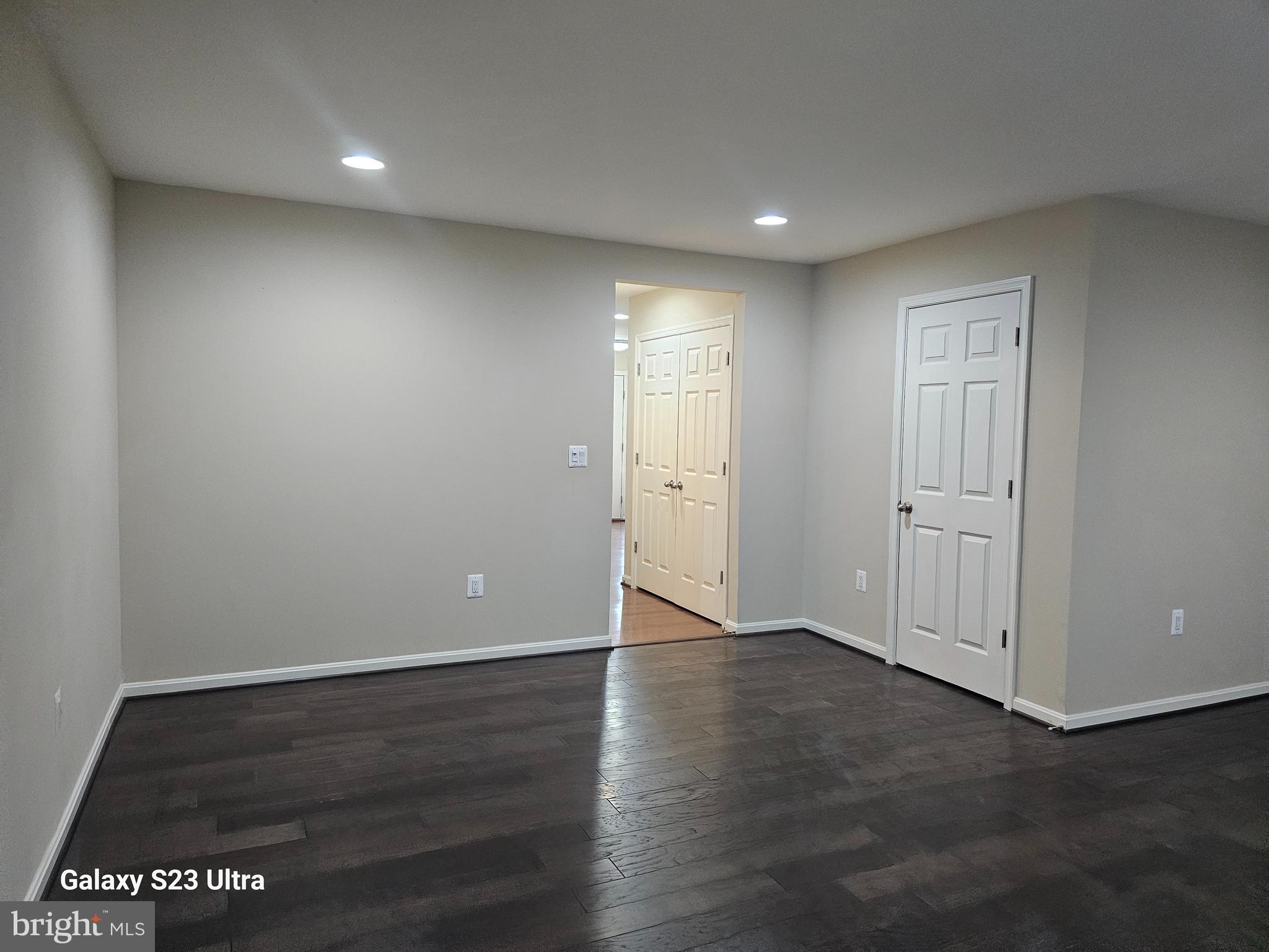 25634 Pleasant Valley Road Chantilly, VA 20152 - Photo 6 of 40 an empty room with wooden floor & windows