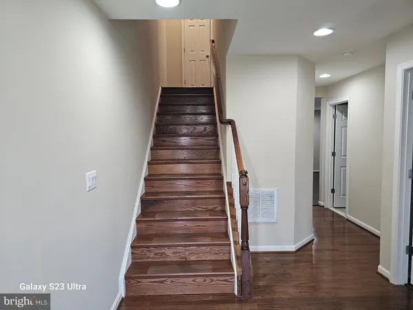 a view of entryway with wooden floor