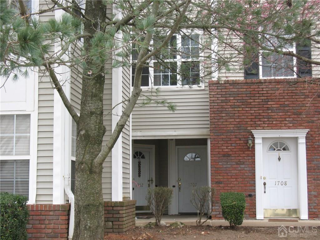 1707 Ridgeview Court, Unit 1707 Sayreville, NJ 08859 - Photo 2 of 3 a front view of a house