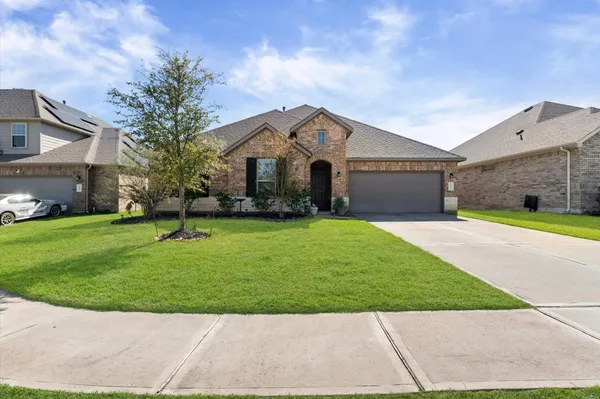 a front view of house with yard and green space