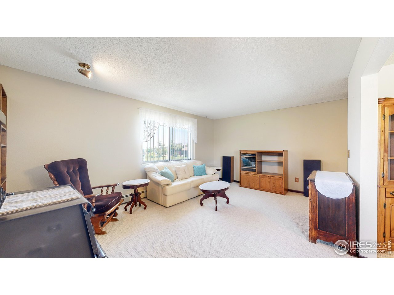 2812 Lake Hollow Road Berthoud, CO 80513 - Photo 14 of 39 a living room with furniture and a window