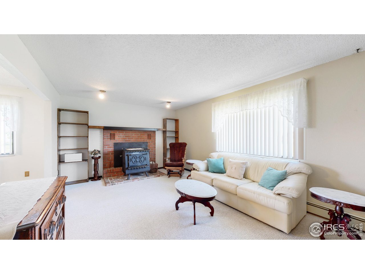2812 Lake Hollow Road Berthoud, CO 80513 - Photo 16 of 39 a living room with furniture and a fireplace