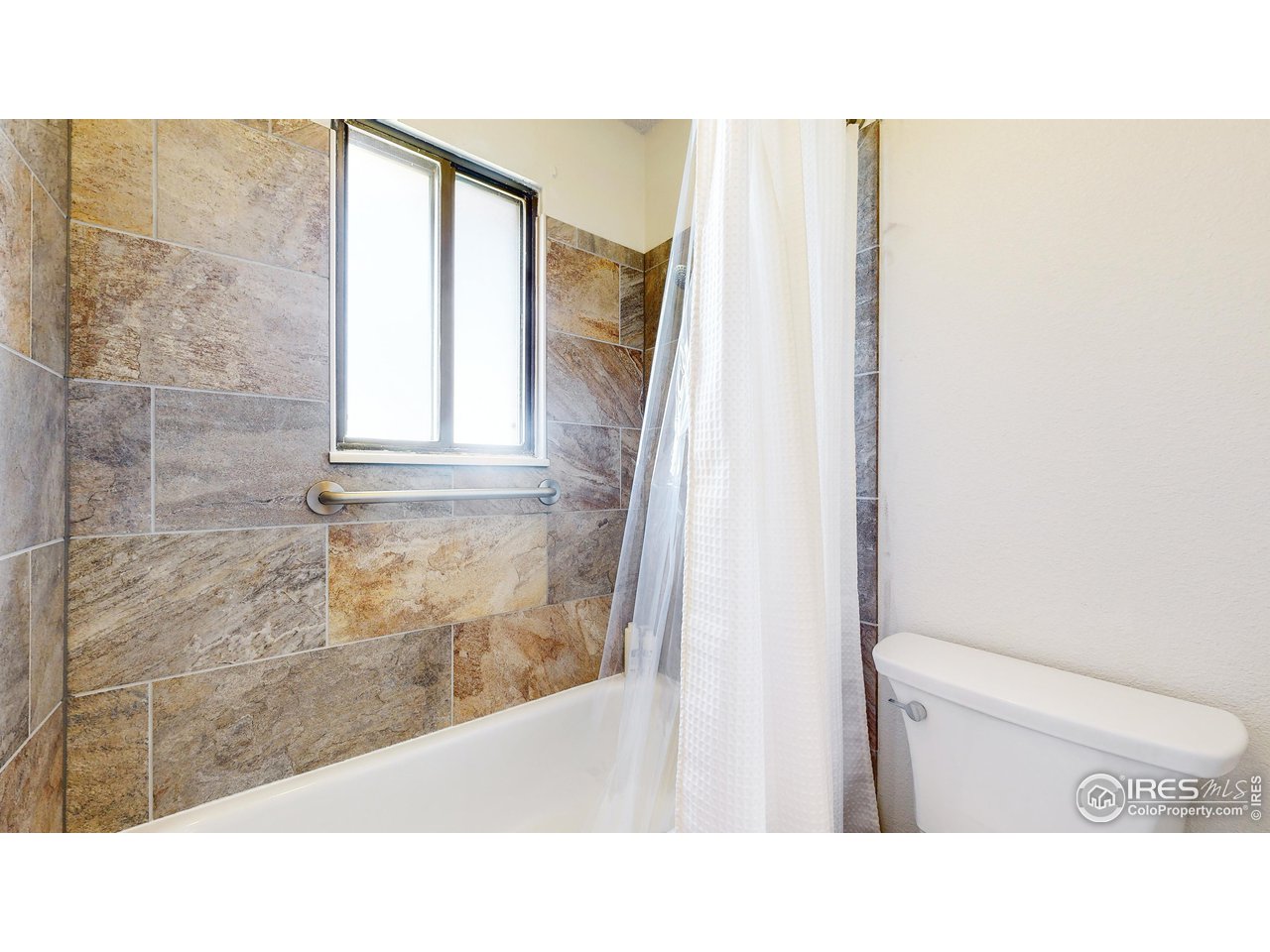 2812 Lake Hollow Road Berthoud, CO 80513 - Photo 25 of 39 a bathroom with a toilet sink and mirror