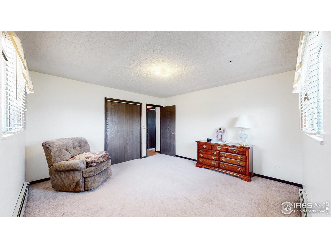 2812 Lake Hollow Road Berthoud, CO 80513 - Photo 27 of 39 a living room with furniture and a window