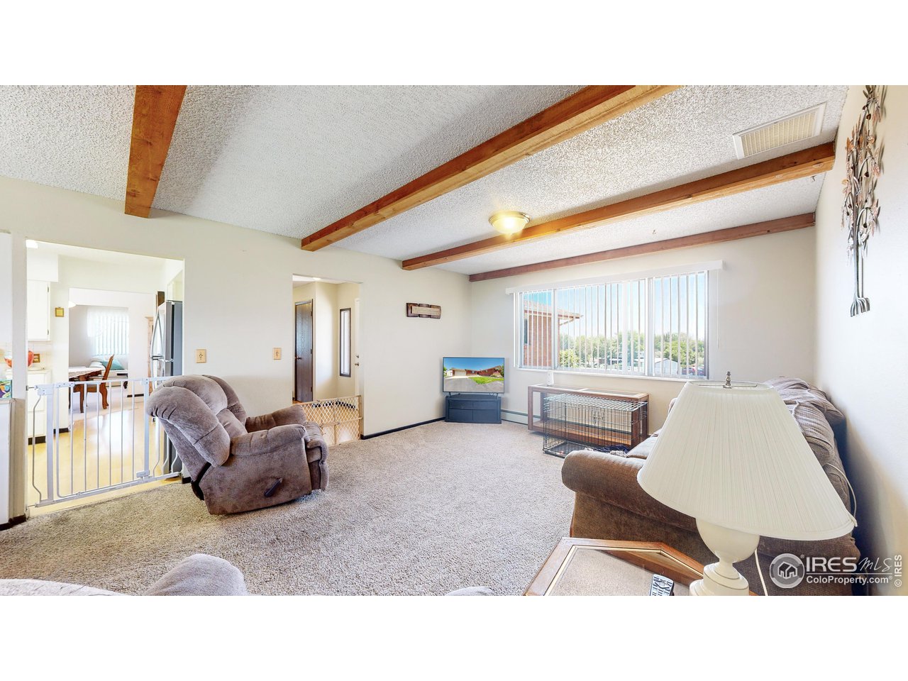 2812 Lake Hollow Road Berthoud, CO 80513 - Photo 6 of 39 a living room with furniture and a large window