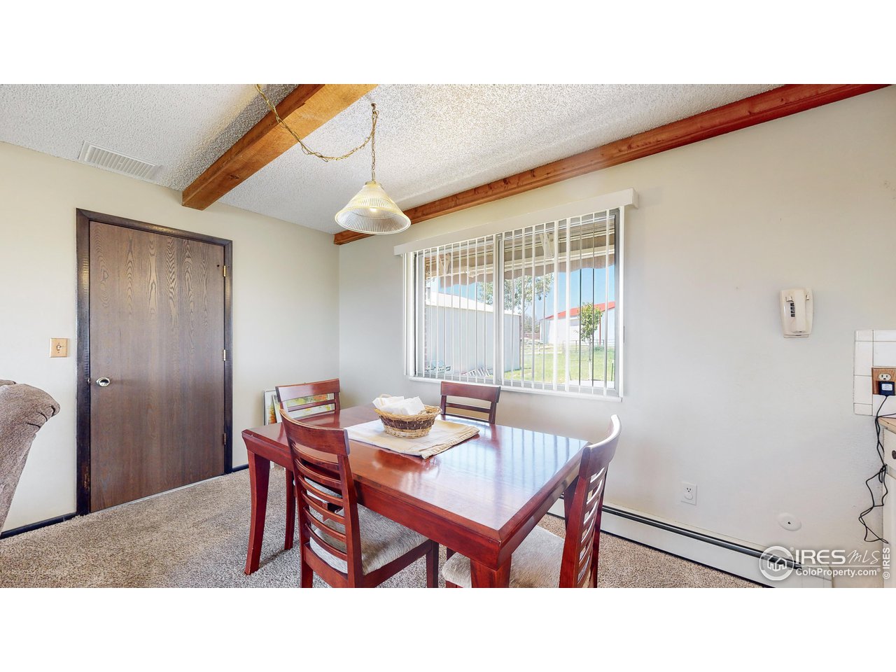 2812 Lake Hollow Road Berthoud, CO 80513 - Photo 7 of 39 a kitchen with a table and chairs in it