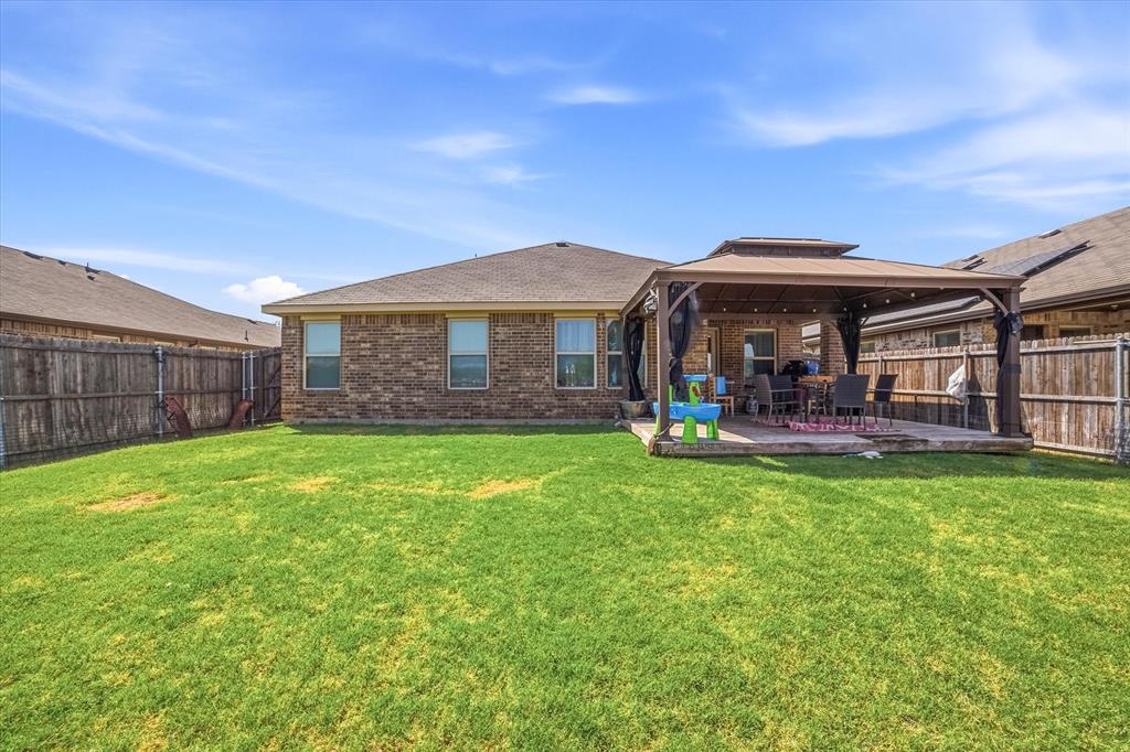 2126 Rubin Road Fate, TX 75189 - Photo 13 of 19 a view of a house with a backyard