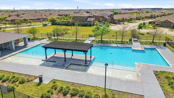 a view of a swimming pool with seating area
