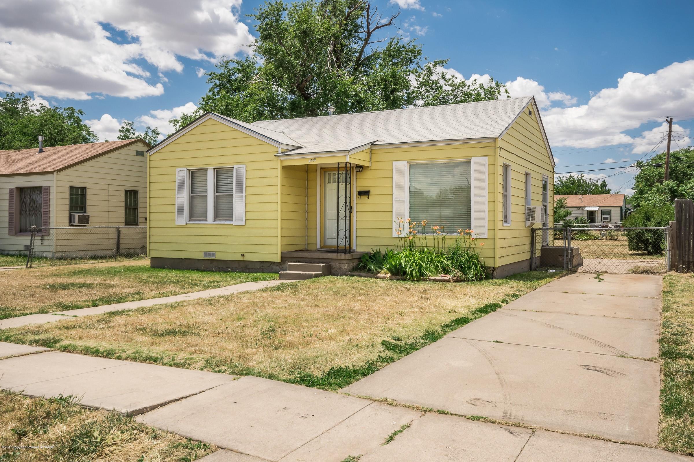 4220 South Harrison Street Amarillo, TX 79110 - Photo 1 of 15 a view of a brick house with a yard