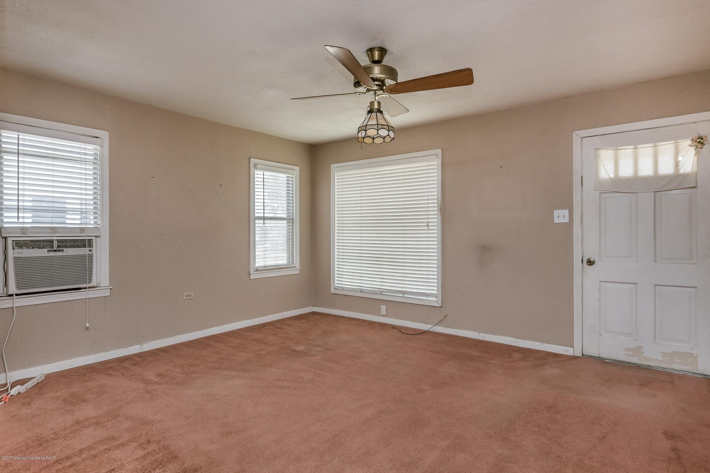 4220 South Harrison Street Amarillo, TX 79110 - Photo 4 of 15 a view of an empty room with a window