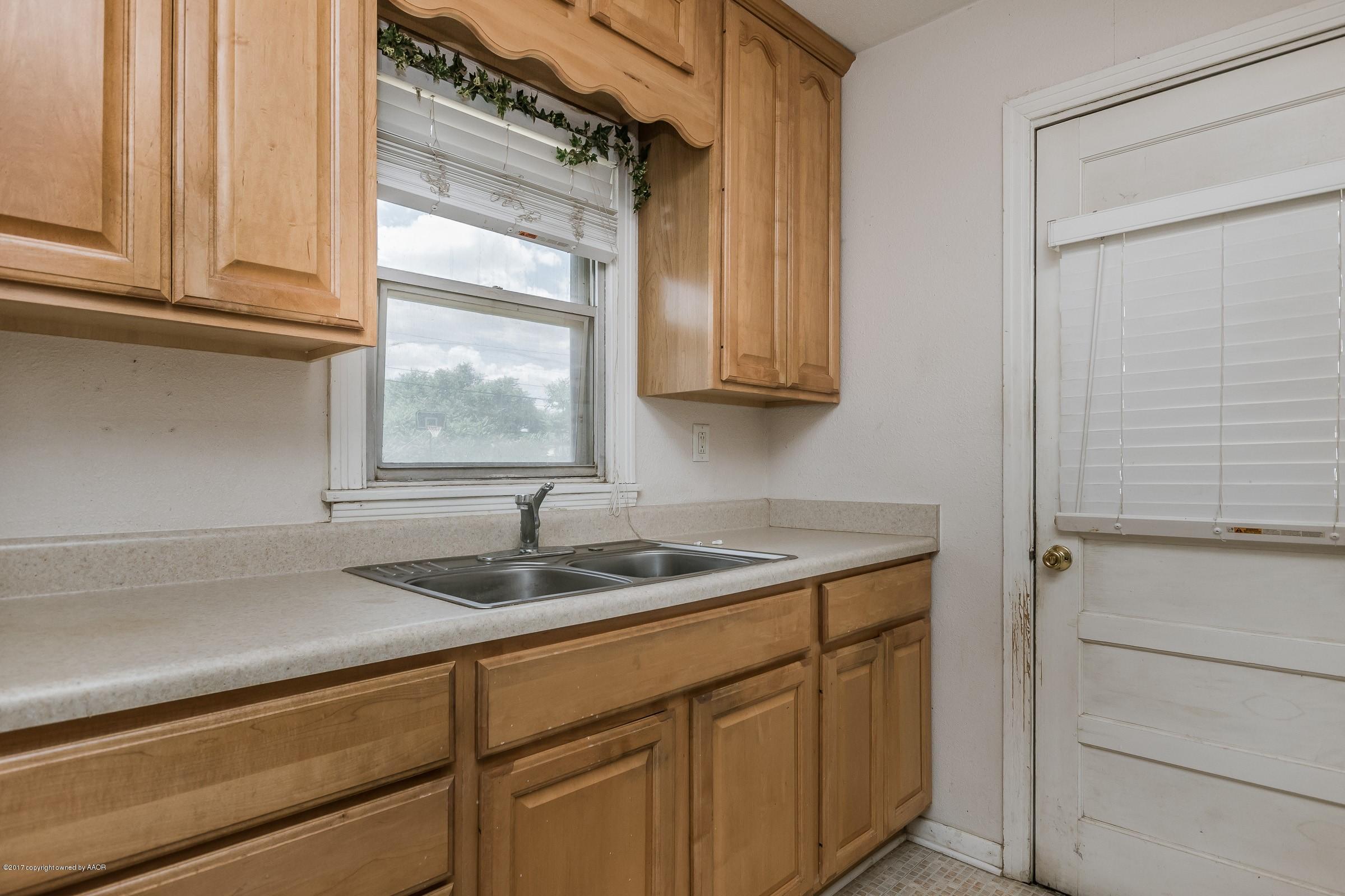 4220 South Harrison Street Amarillo, TX 79110 - Photo 6 of 15 a kitchen with a sink and cabinets