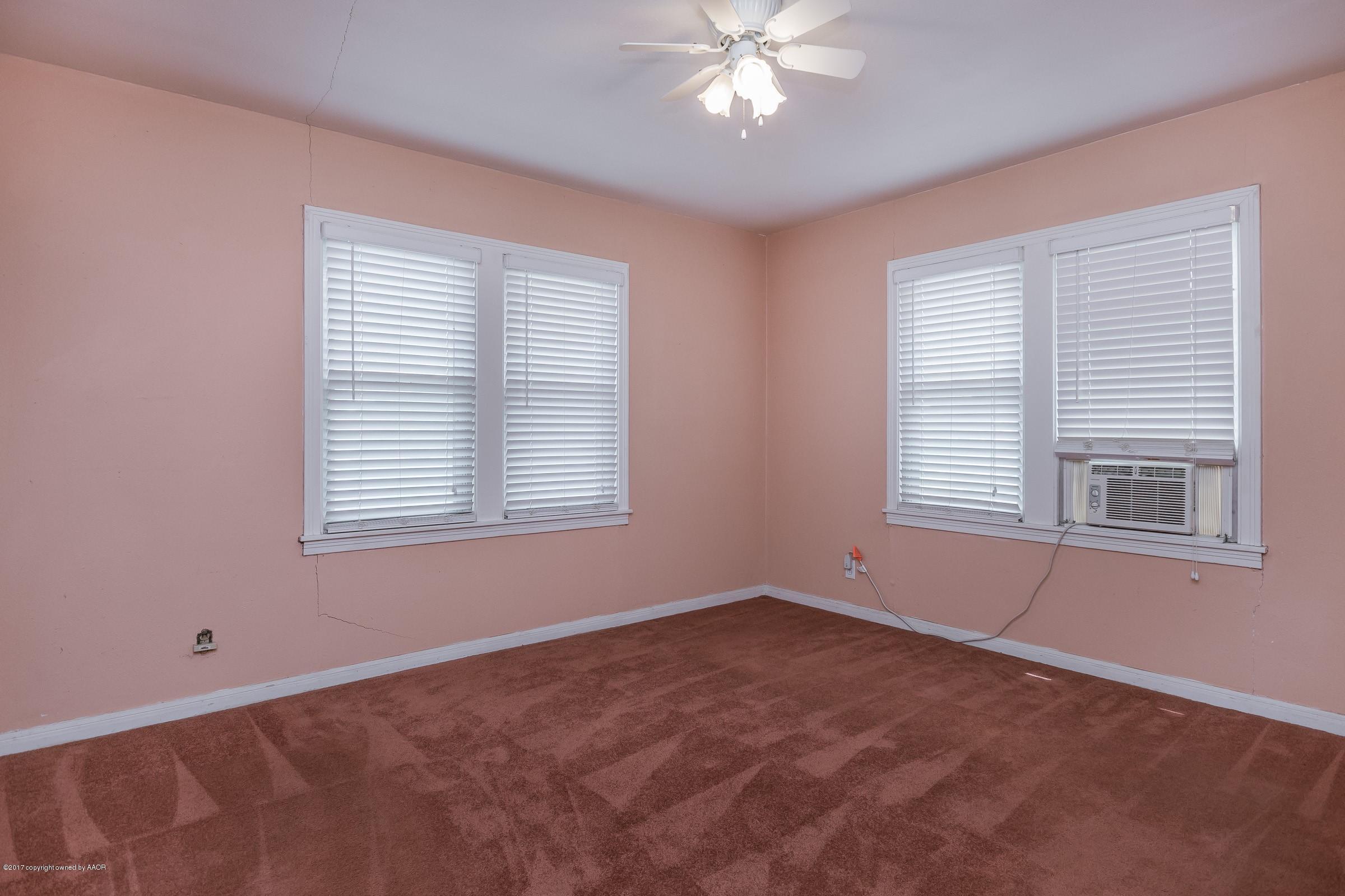 4220 South Harrison Street Amarillo, TX 79110 - Photo 9 of 15 a view of an empty room with a window