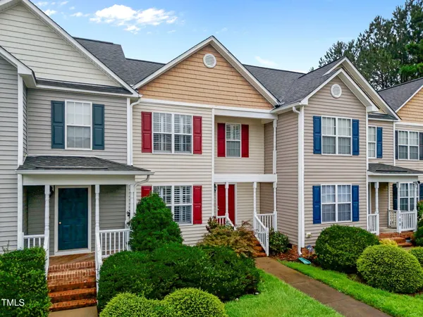 front view of brick house with a yard
