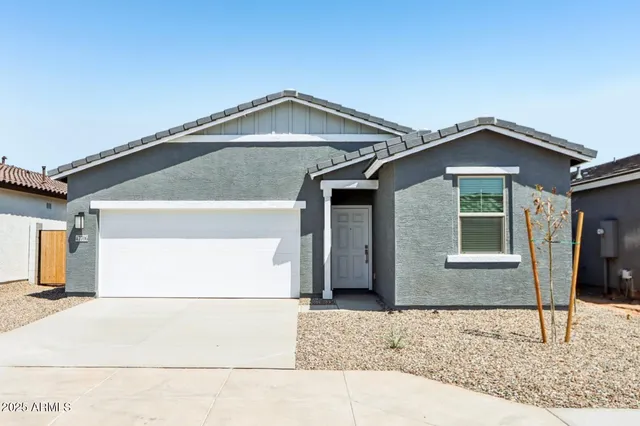 a front view of a house with garage
