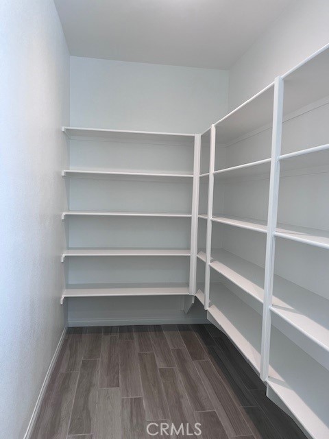 24261 Arroyo Drive Menifee, CA 92584 - Photo 15 of 24 a view of a room with shelf on the wall