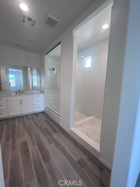 24261 Arroyo Drive Menifee, CA 92584 - Photo 18 of 24 a view of a bathroom from the hallway
