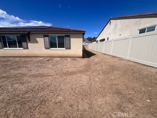 24261 Arroyo Drive Menifee, CA 92584 - Photo 22 of 24 a view of a house with backyard