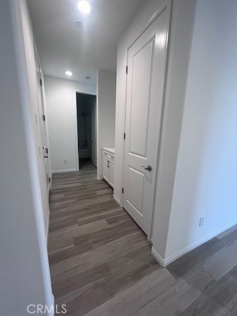 24261 Arroyo Drive Menifee, CA 92584 - Photo 8 of 24 a view of a hallway with wooden floor