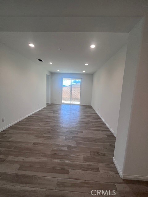 24261 Arroyo Drive Menifee, CA 92584 - Photo 9 of 24 a view of empty room with wooden floor