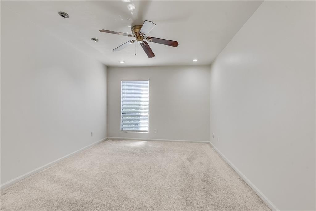 244 13th Street Northeast, Unit 118 Atlanta, GA 30309 - Photo 23 of 48 a view of an empty room with a window