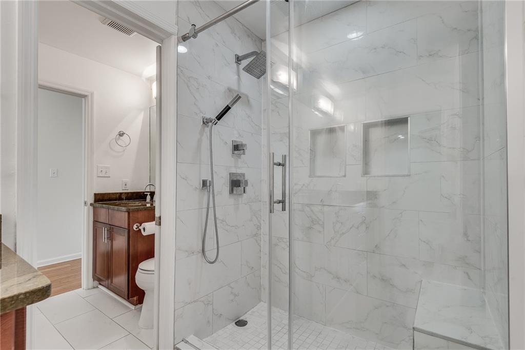 244 13th Street Northeast, Unit 118 Atlanta, GA 30309 - Photo 28 of 48 a bathroom with a shower