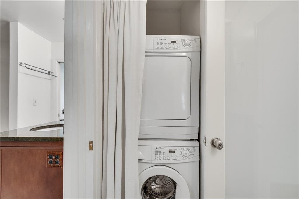 244 13th Street Northeast, Unit 118 Atlanta, GA 30309 - Photo 31 of 48 a utility room with dryer and washer