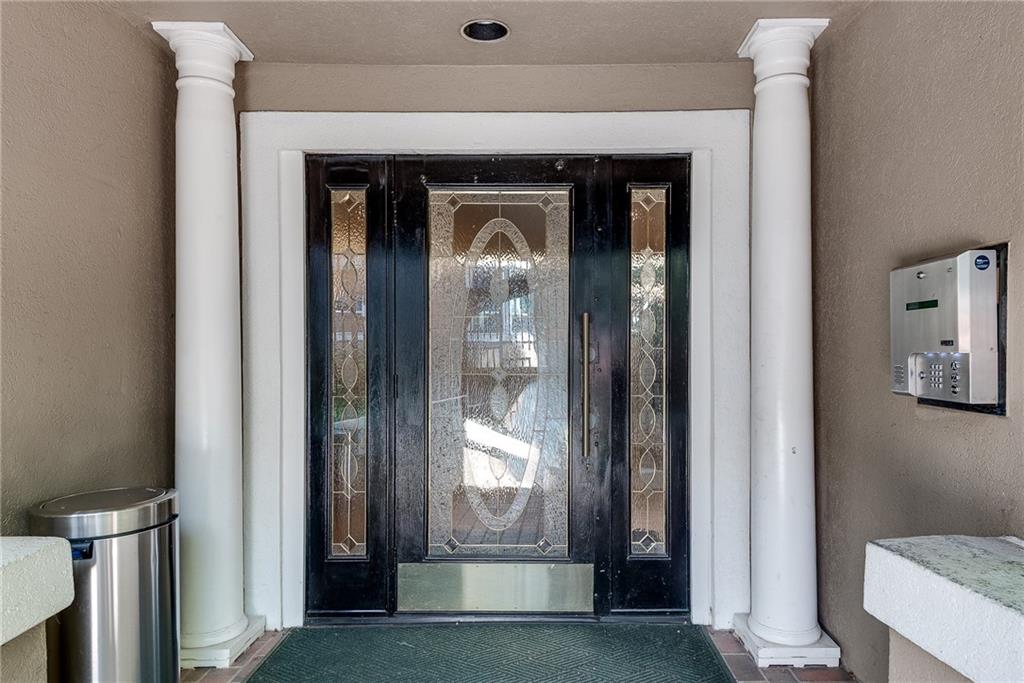 244 13th Street Northeast, Unit 118 Atlanta, GA 30309 - Photo 37 of 48 a view of a wooden door with a glass door
