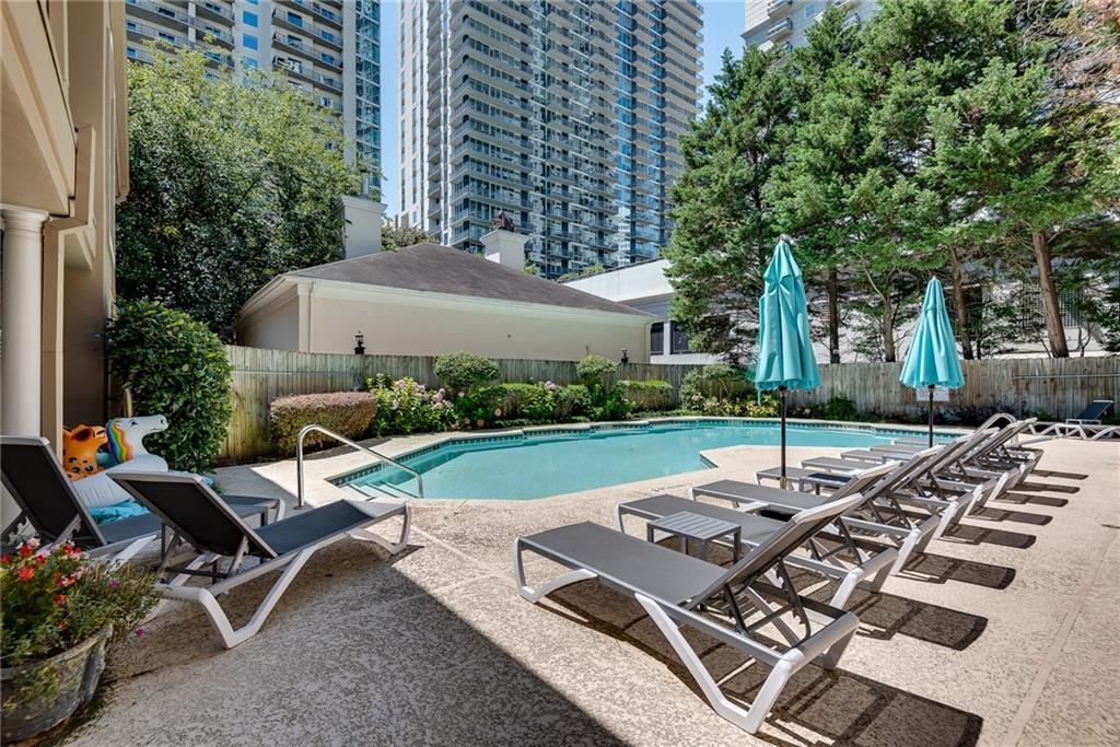 244 13th Street Northeast, Unit 118 Atlanta, GA 30309 - Photo 38 of 48 a view of a backyard with sitting area
