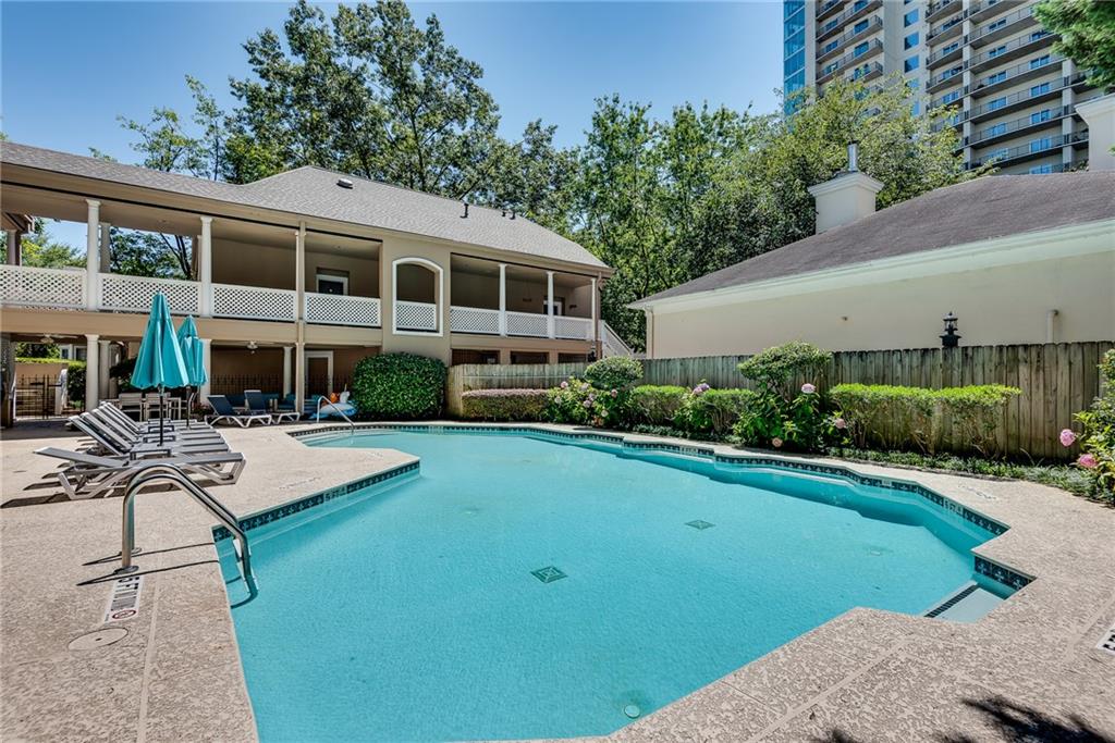 244 13th Street Northeast, Unit 118 Atlanta, GA 30309 - Photo 39 of 48 a front view of a house with swimming pool having outdoor seating