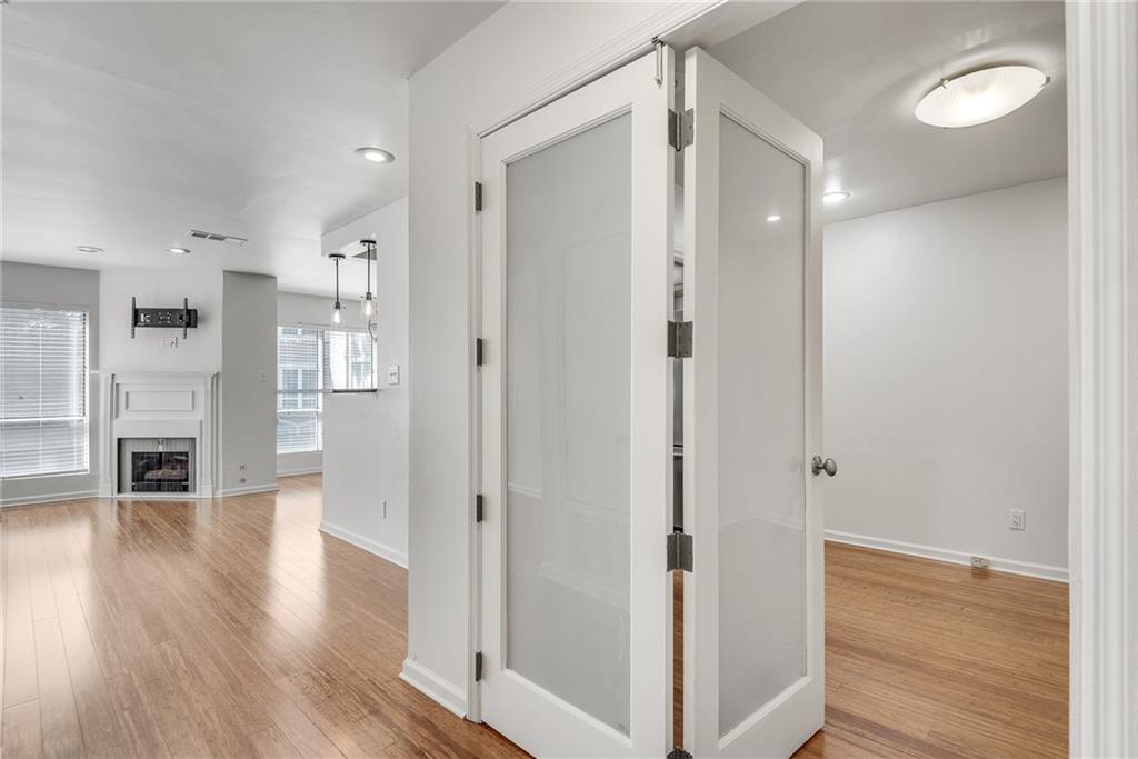 244 13th Street Northeast, Unit 118 Atlanta, GA 30309 - Photo 4 of 48 a view of a hallway with wooden floor