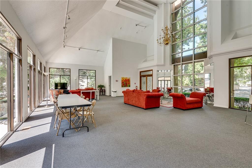 244 13th Street Northeast, Unit 118 Atlanta, GA 30309 - Photo 43 of 48 a bed room with furniture and a window