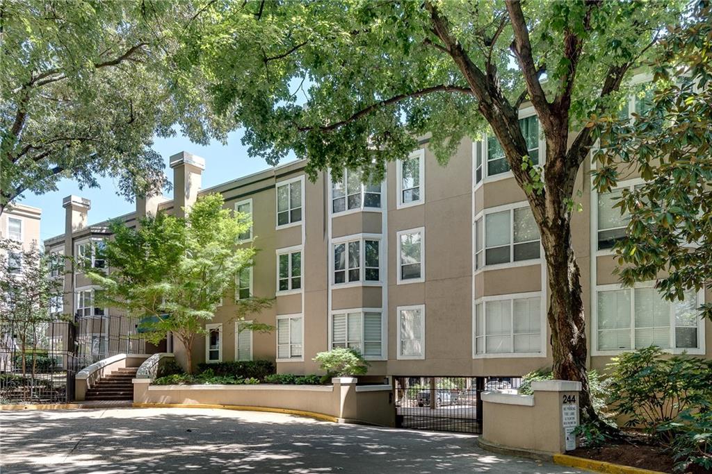 244 13th Street Northeast, Unit 118 Atlanta, GA 30309 - Photo 46 of 48 a front view of a house with a garden