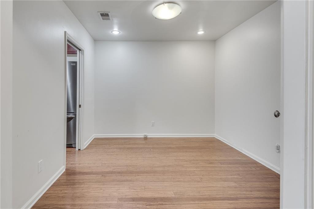 244 13th Street Northeast, Unit 118 Atlanta, GA 30309 - Photo 6 of 48 a view of hallway with wooden floor