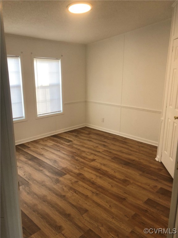 5523 Ridge Road Heathsville, VA 22473 - Photo 19 of 23 Unfurnished room with dark wood-type flooring
