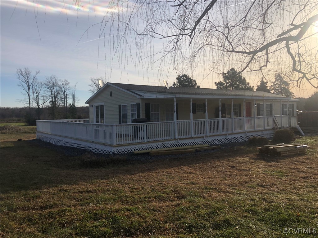 5523 Ridge Road Heathsville, VA 22473 - Photo 3 of 23 Back house at dusk with a lawn