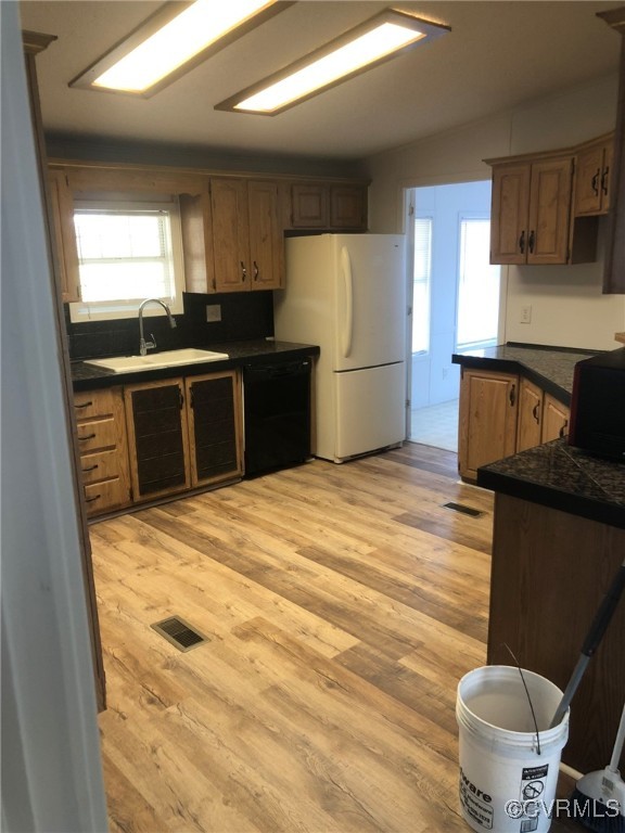 5523 Ridge Road Heathsville, VA 22473 - Photo 10 of 23 Kitchen with sink, white refrigerator, black dishw