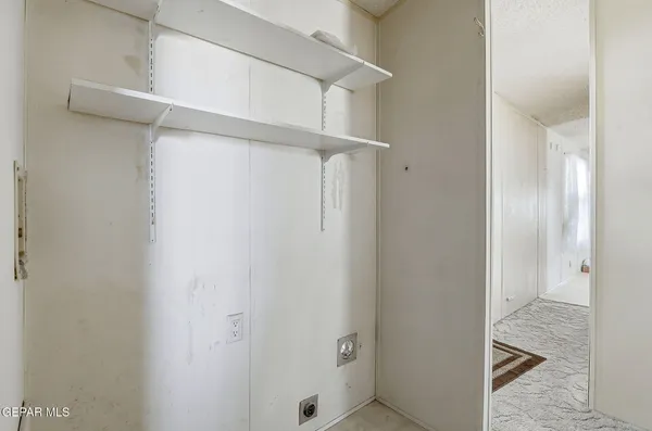 a front view of a house with a tree