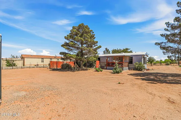 an aerial view of multiple houses with yard