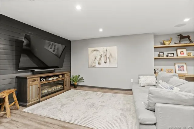 a living room with furniture and a flat screen tv